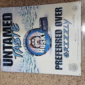 Tin sign untamed taste " husky over grizzly" 2007 19x15.5 approx